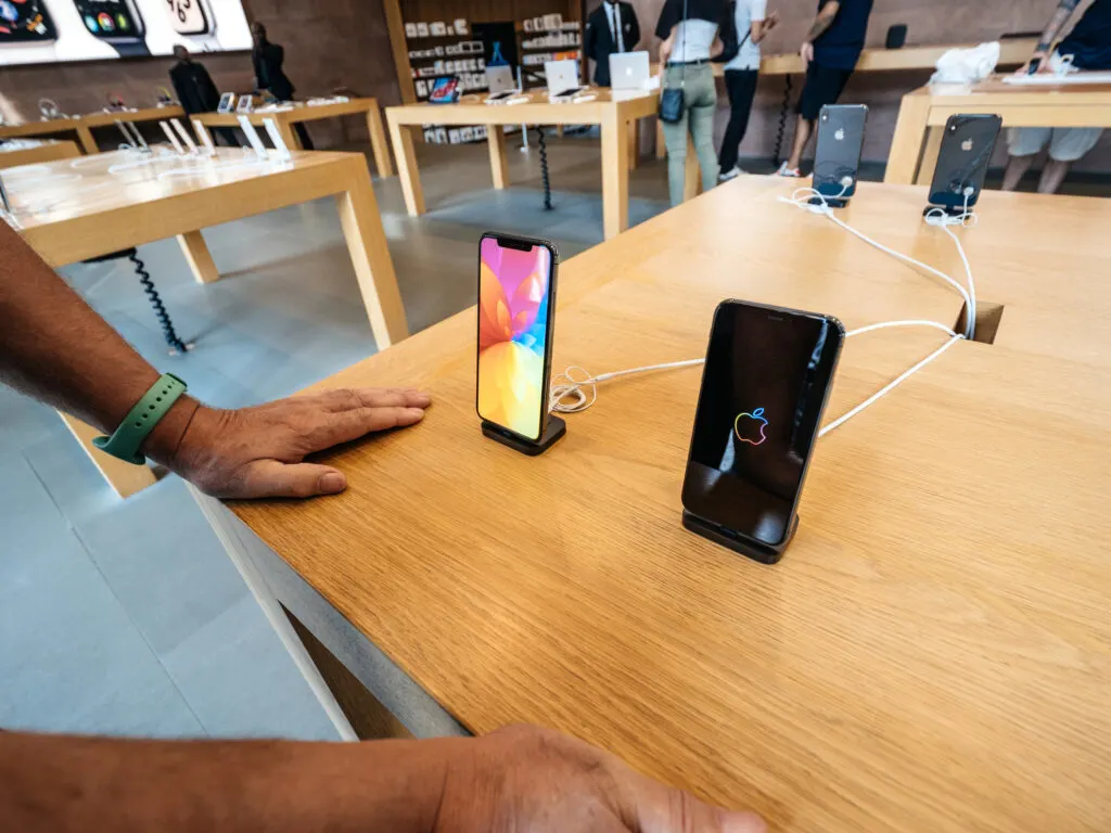 man choosing new iphone in apple store