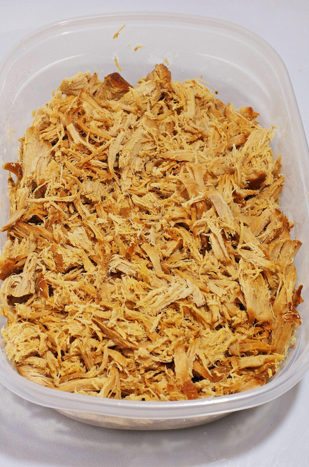 shredded pulled pork in container