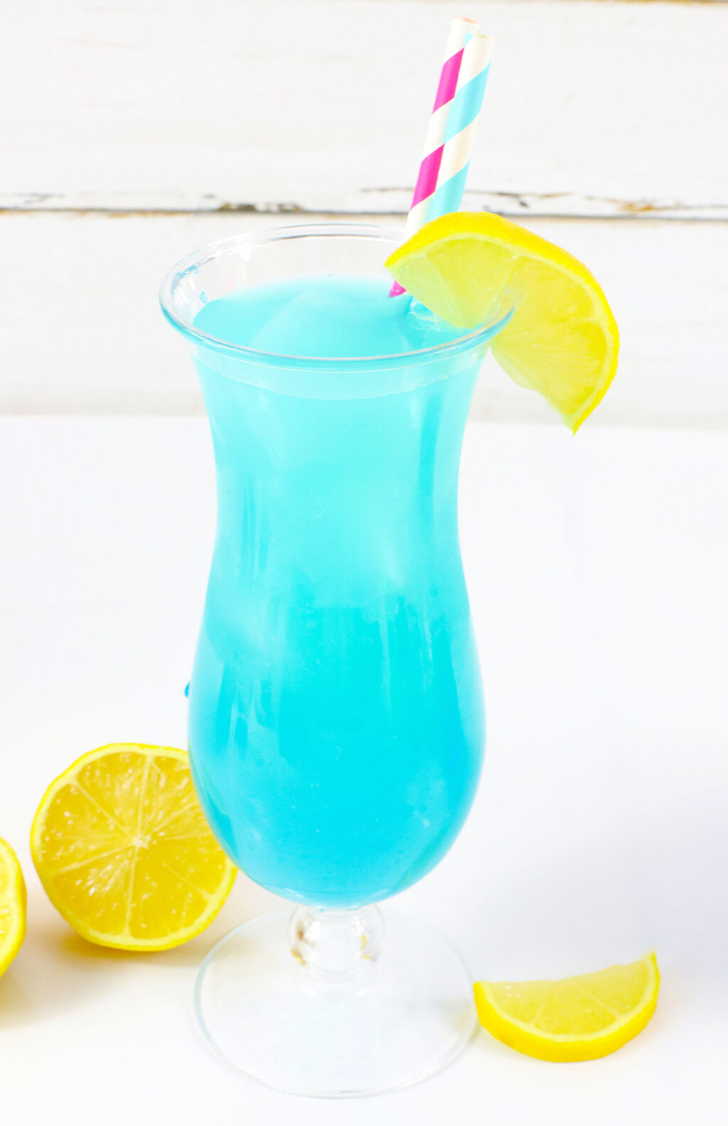 electric lemonade in tall glass on white table