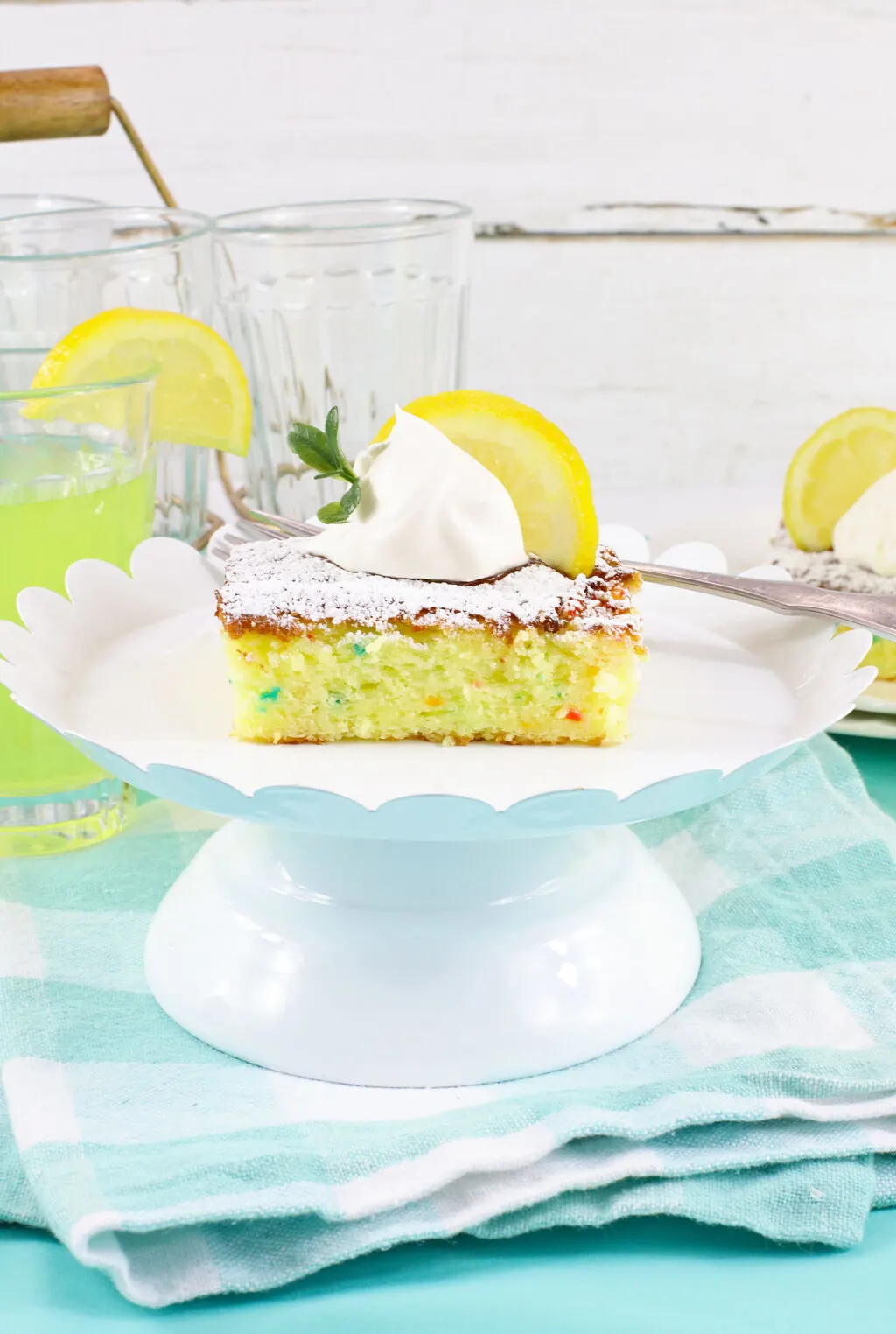 lemon cake bars on white stand