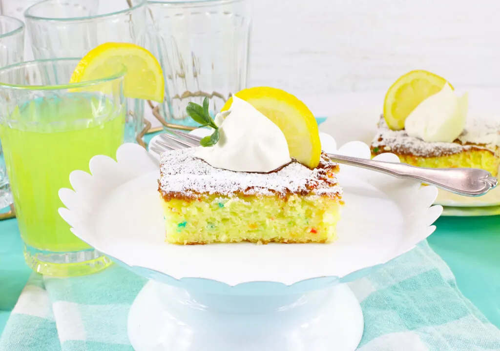 slice of lemon cake bar on white serving tray