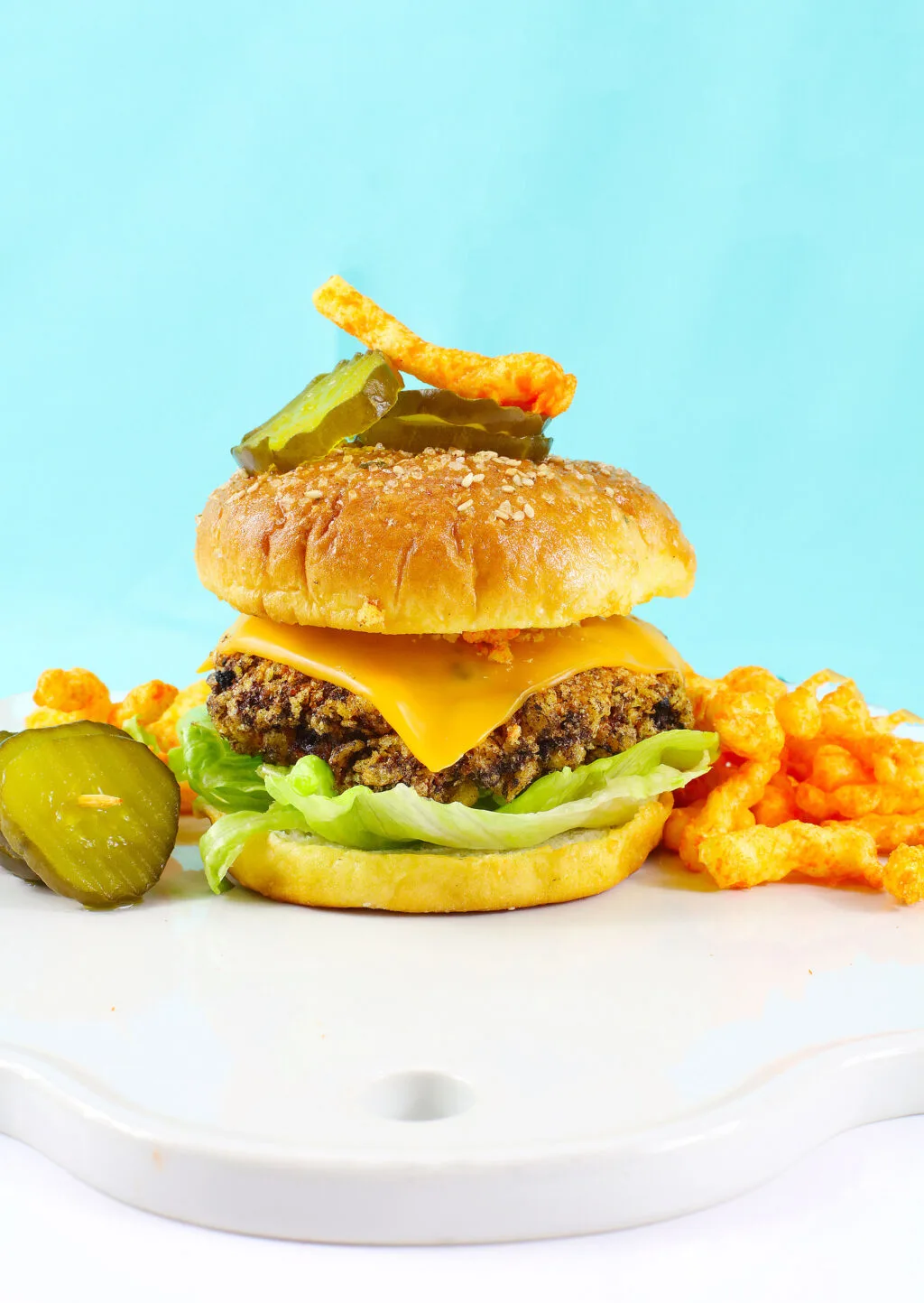 a fully cooked cheetos cheeseburger on a table
