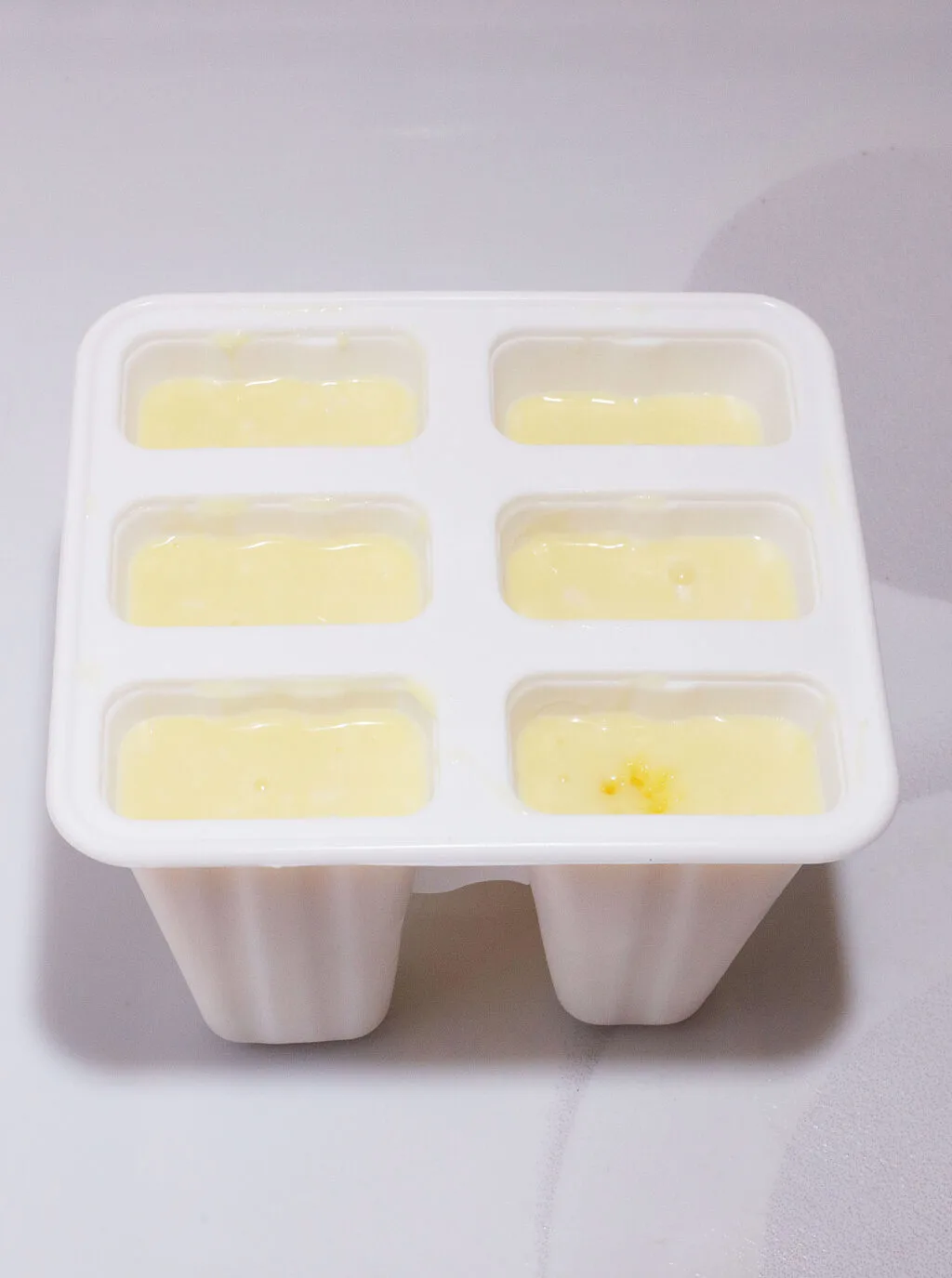 pina colada popsicle molds filled