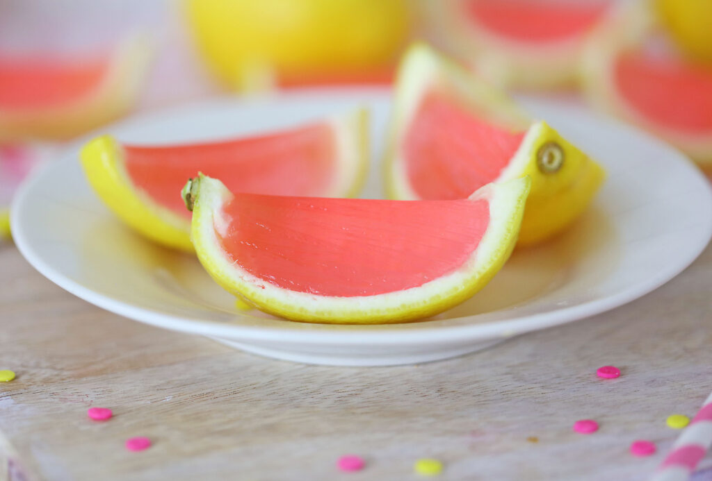 pink lemonade jello shots on white plate