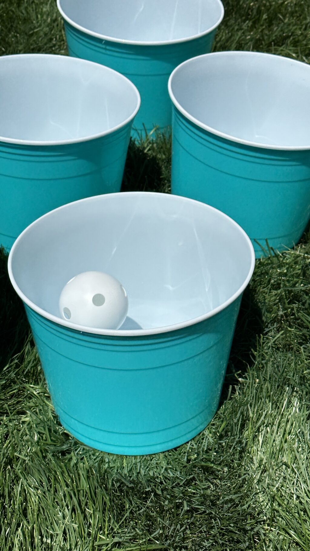 aqua giant yard pong buckets in lawn