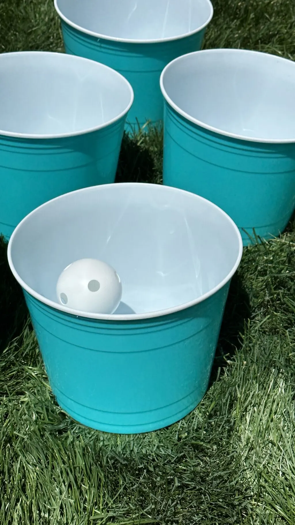 aqua giant yard pong buckets in lawn