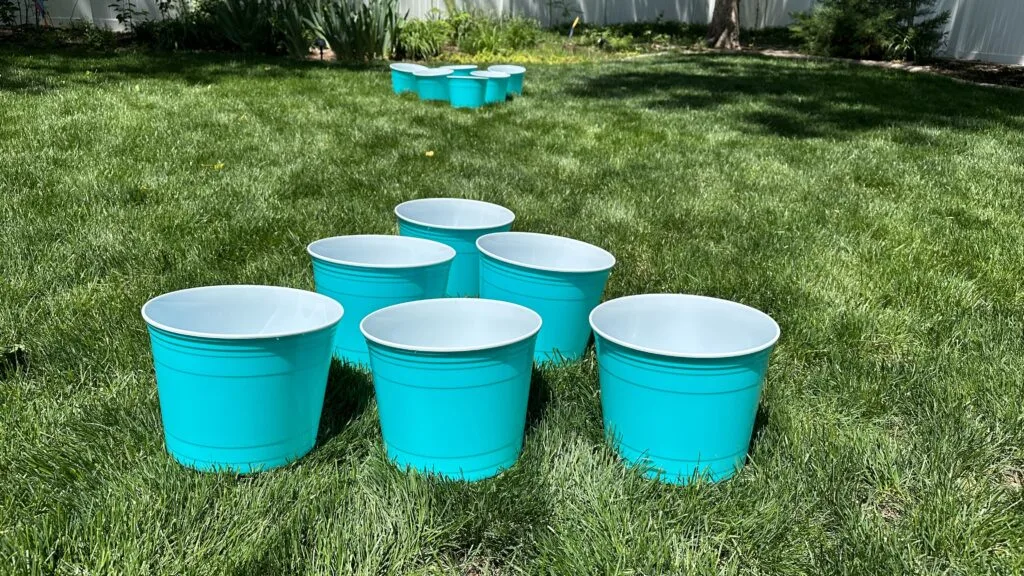 giant yard pong buckets set up in lawn