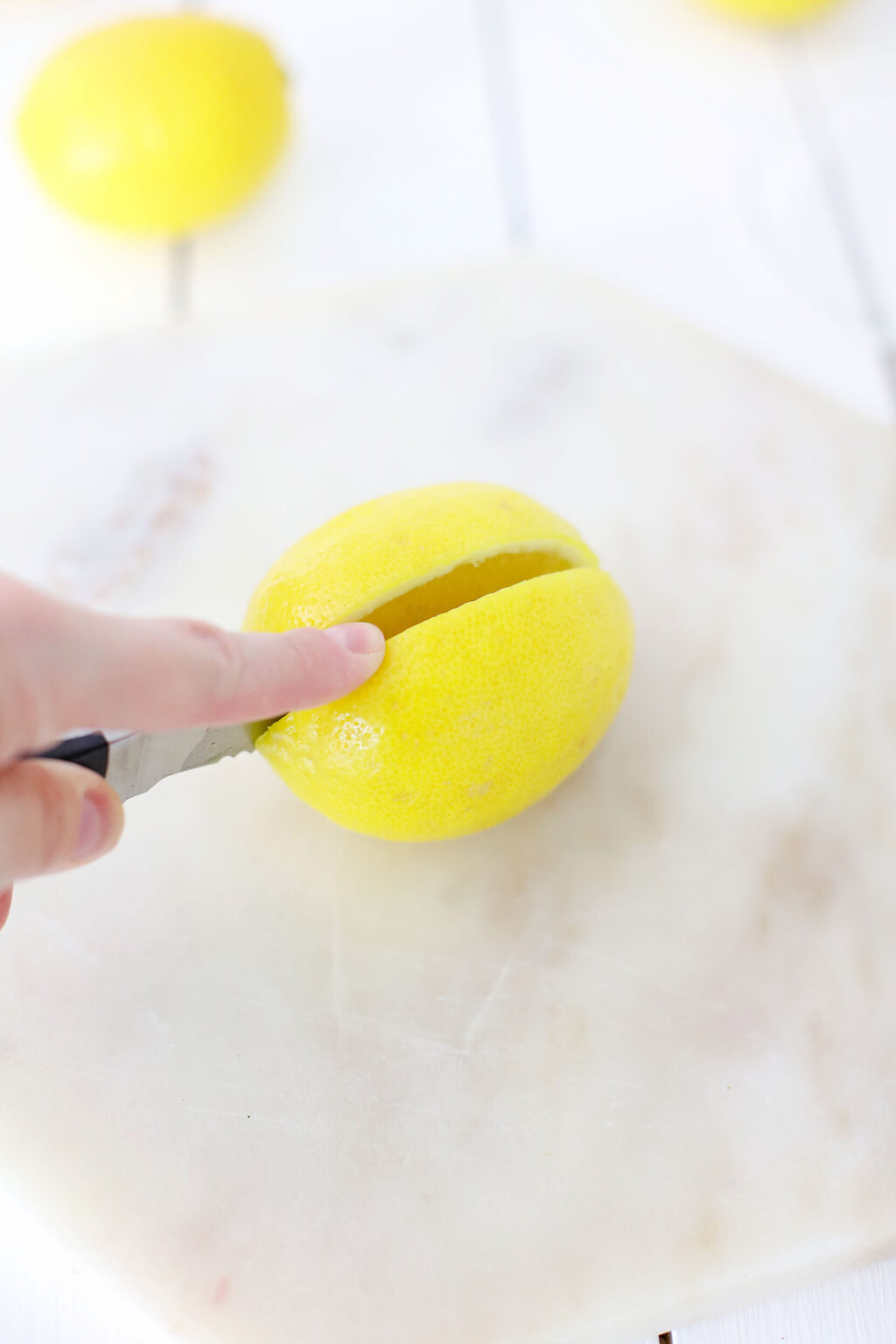 cutting lemons in half