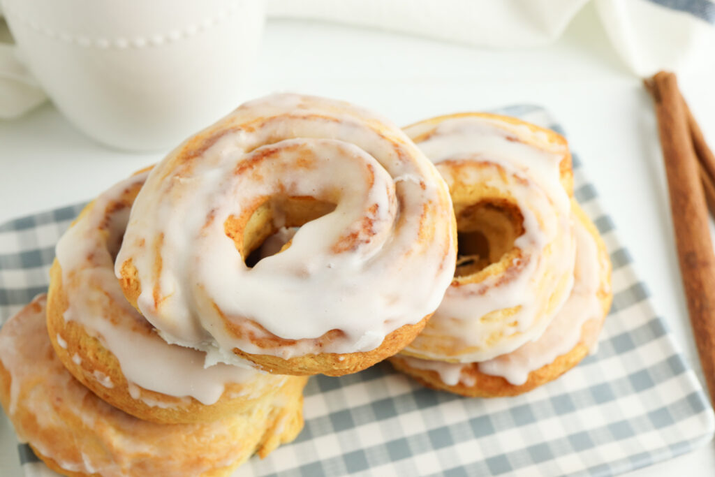 top view of cinnamon roll donuts stacked on top of each other
