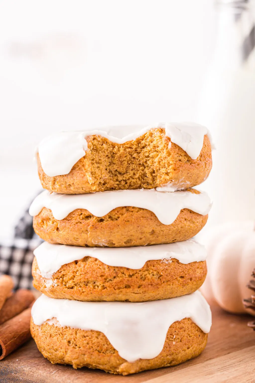 3-ingredient pumpkin donuts stacked on top of each other on table