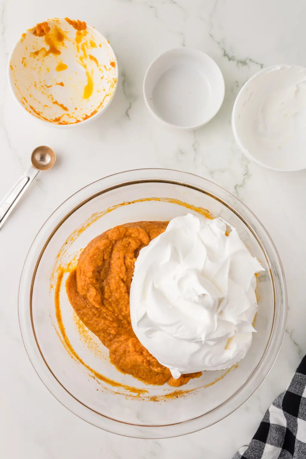 no bake pumpkin pie filling with cool whip in large glass bowl