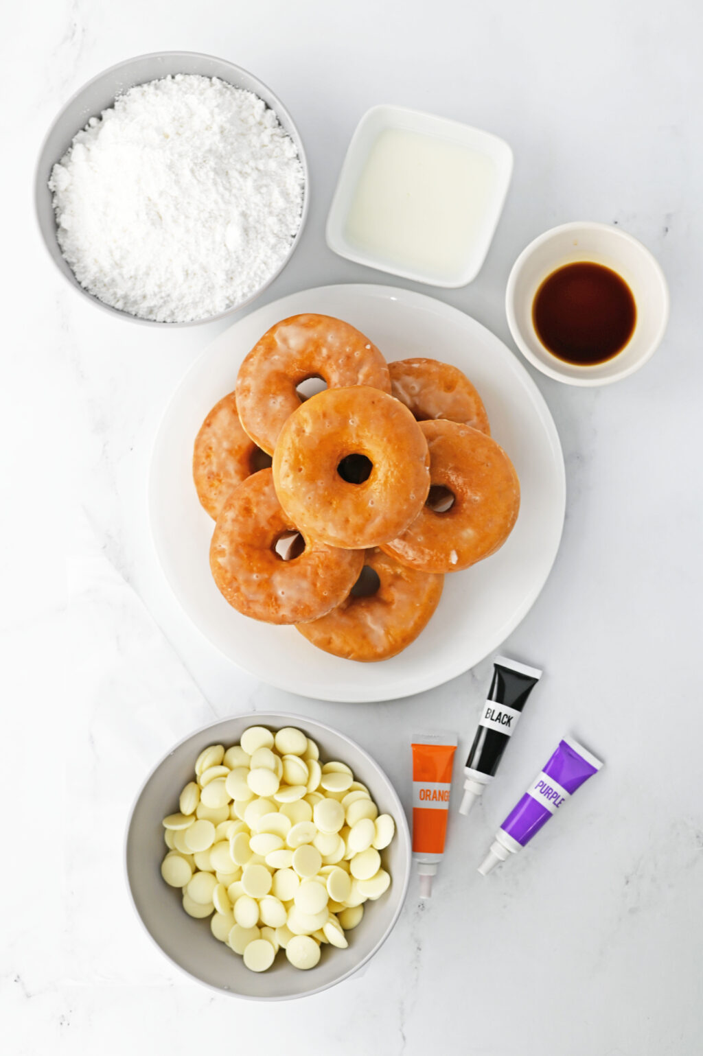 spiderweb donuts ingredients on white table