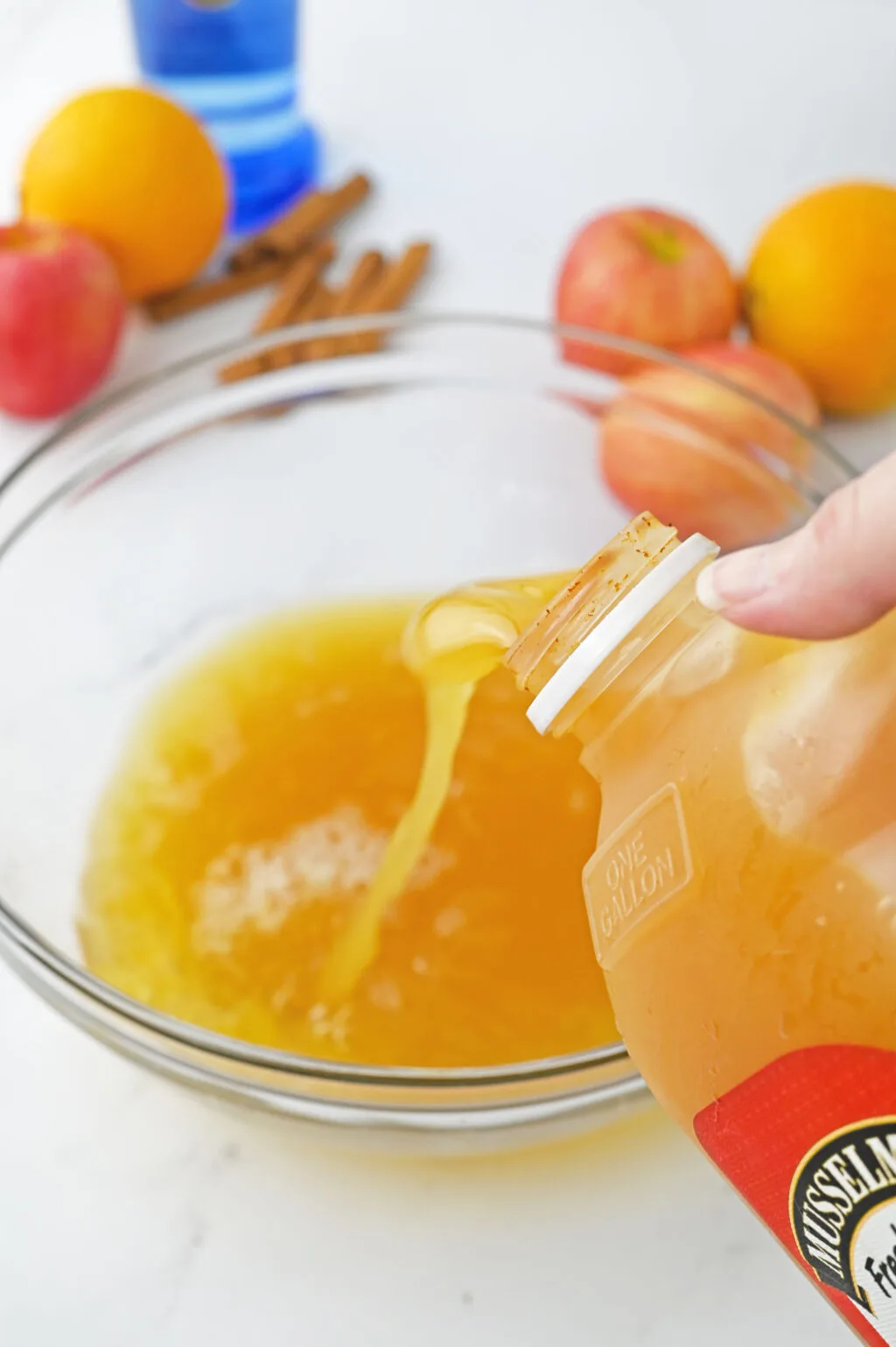 apple cider being poured into bowl