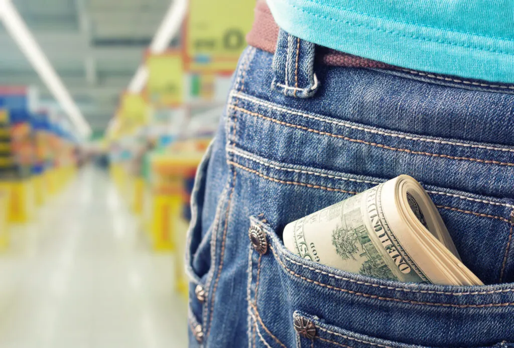money in back pocket at grocery store