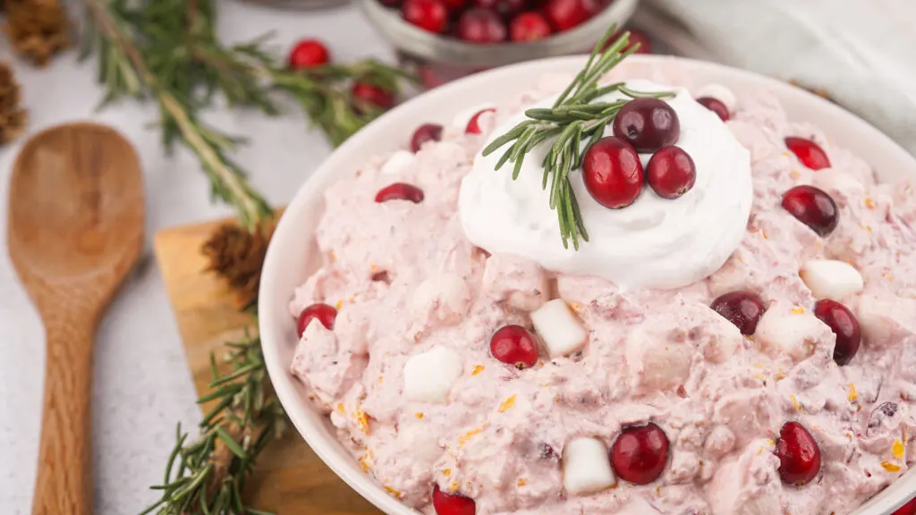 white bowl filled with cranberry fluff salad