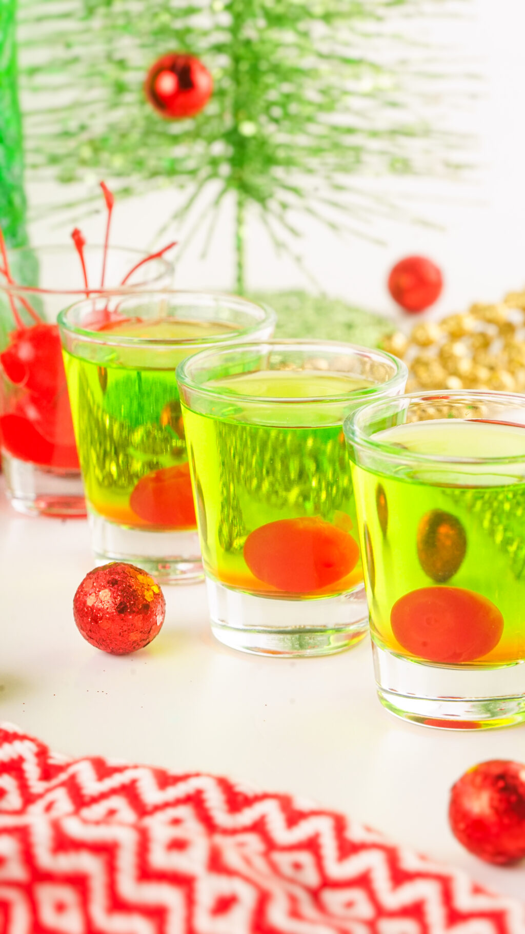 grinch shot glasses on table