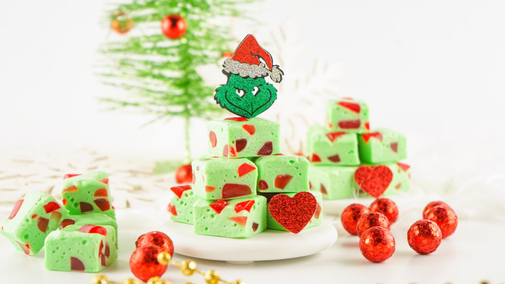 grinch christmas nougat candy stacked on white plate