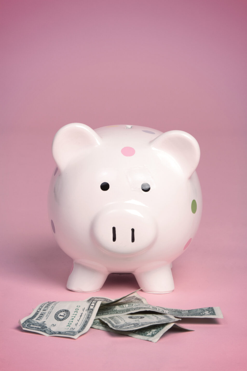 pink piggy bank with 52 week money challenge savings inside
