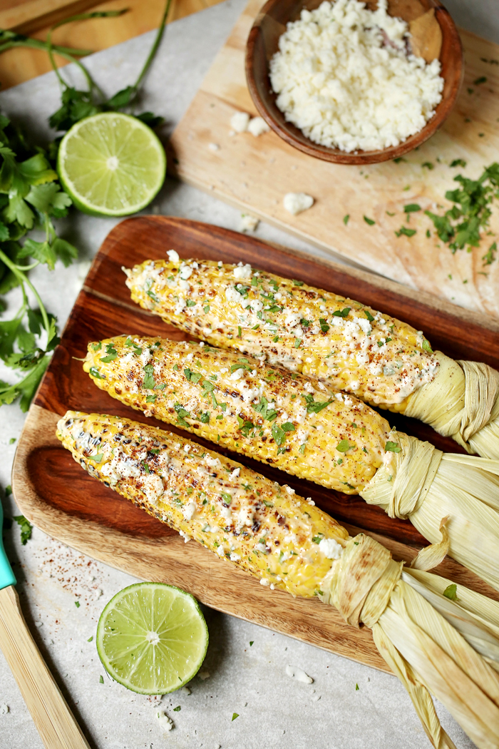 Mexican street corn on the cob on a serving platter
