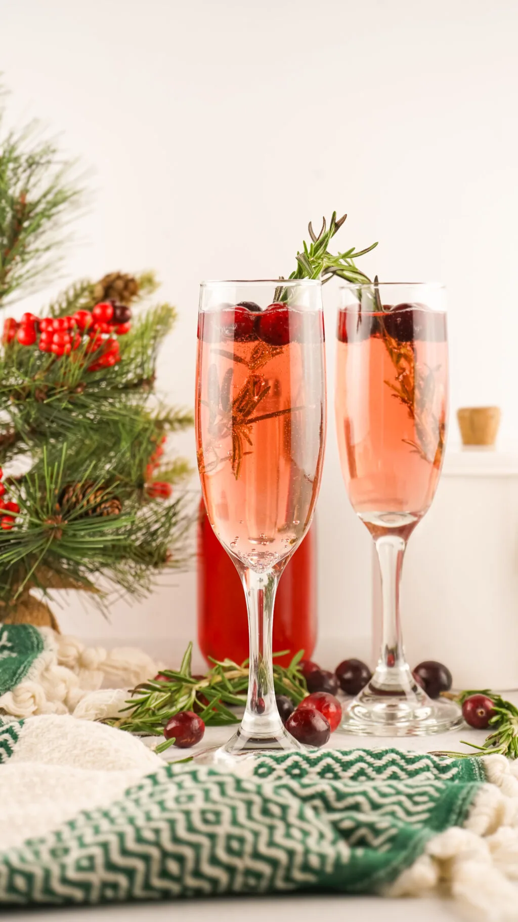 champagne flutes filled with christmas mimosas