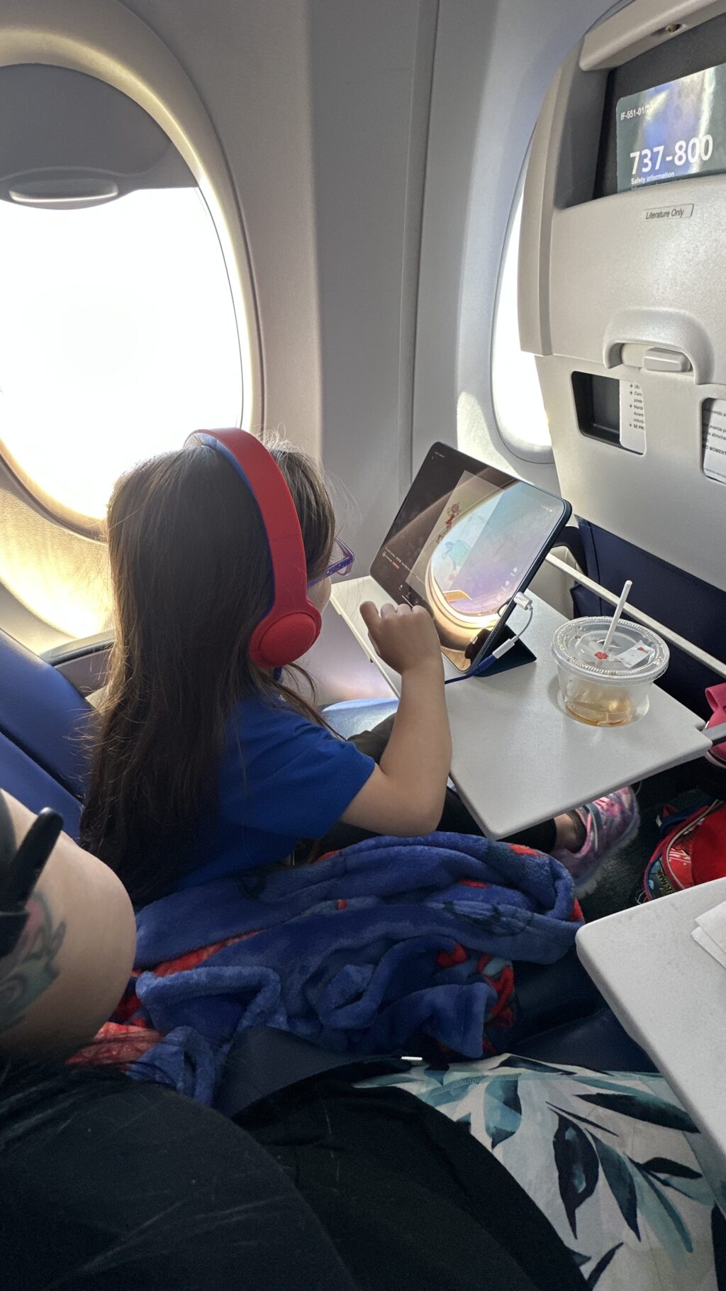 little girl on flight to hawaii