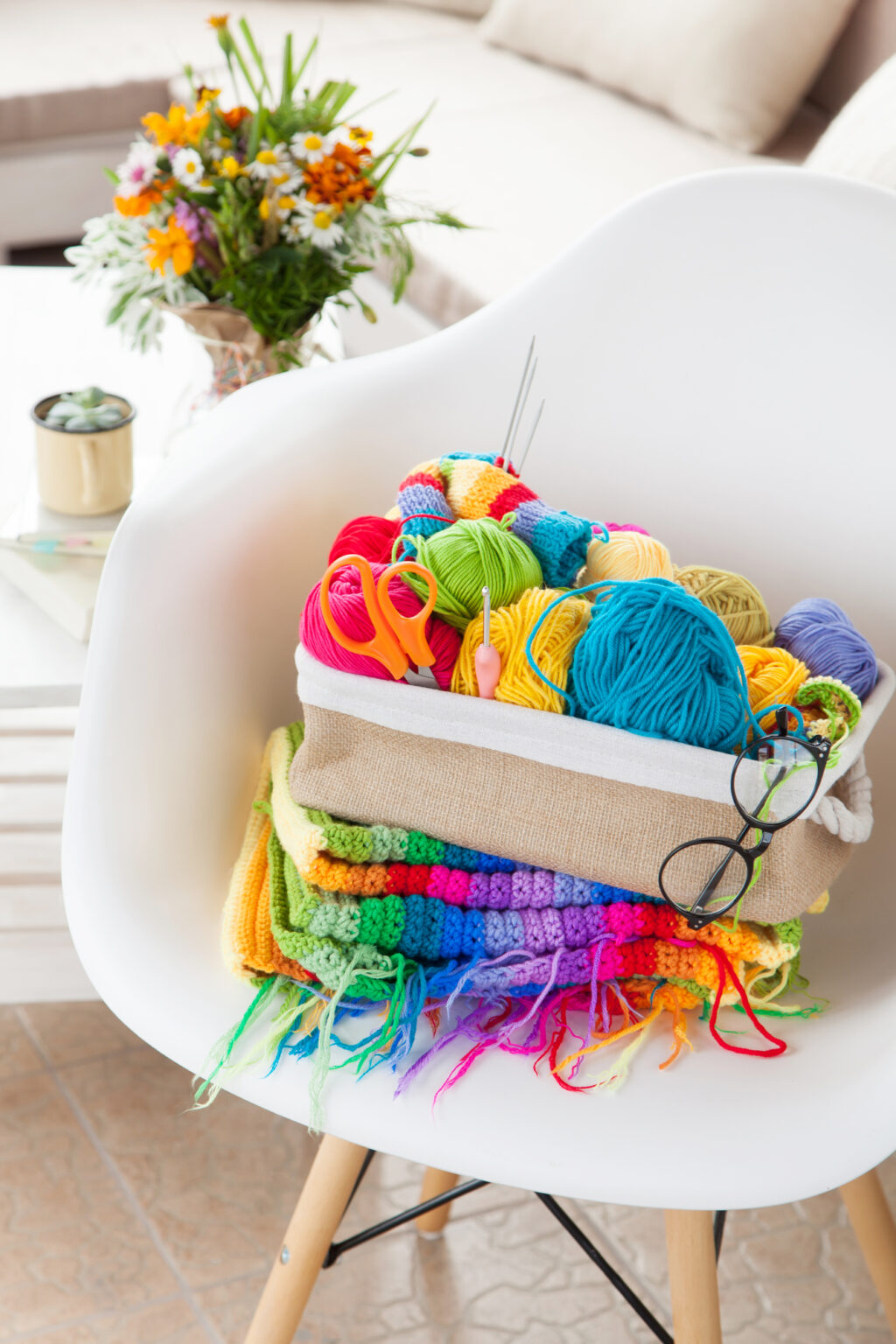 colorful needlework on white chair