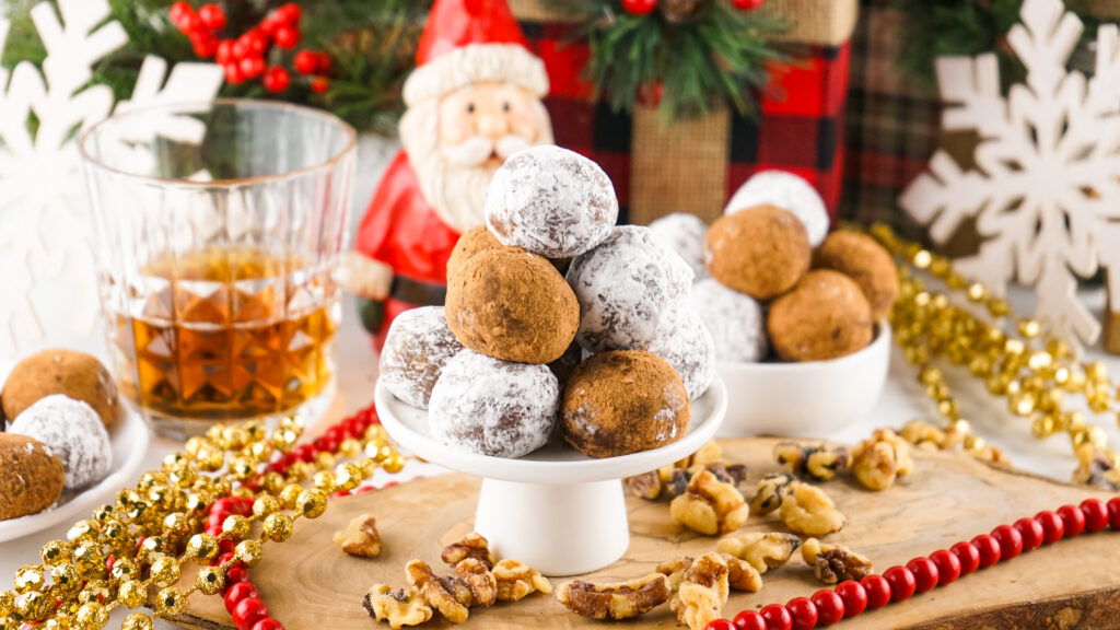 festive table with homemade rum balls on plate