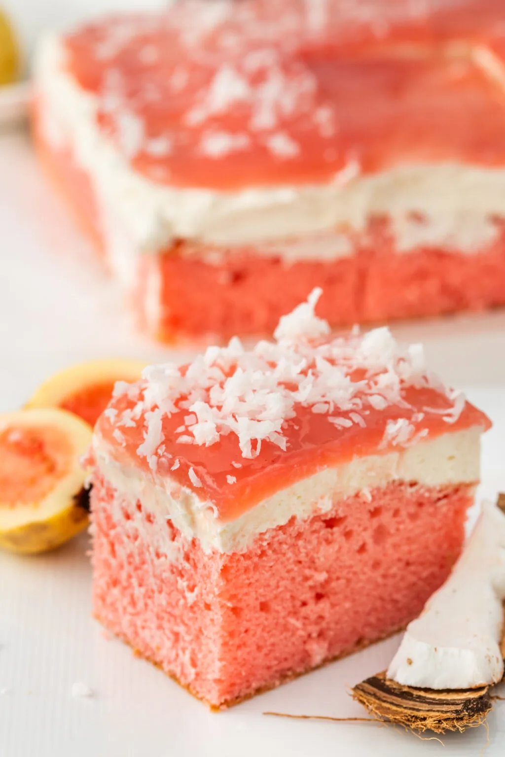slice of guava cake with coconut shreds on top