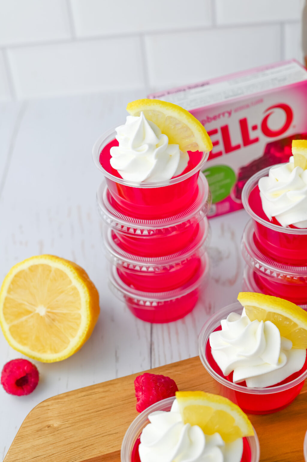 raspberry lemonade jello shots stacked on table