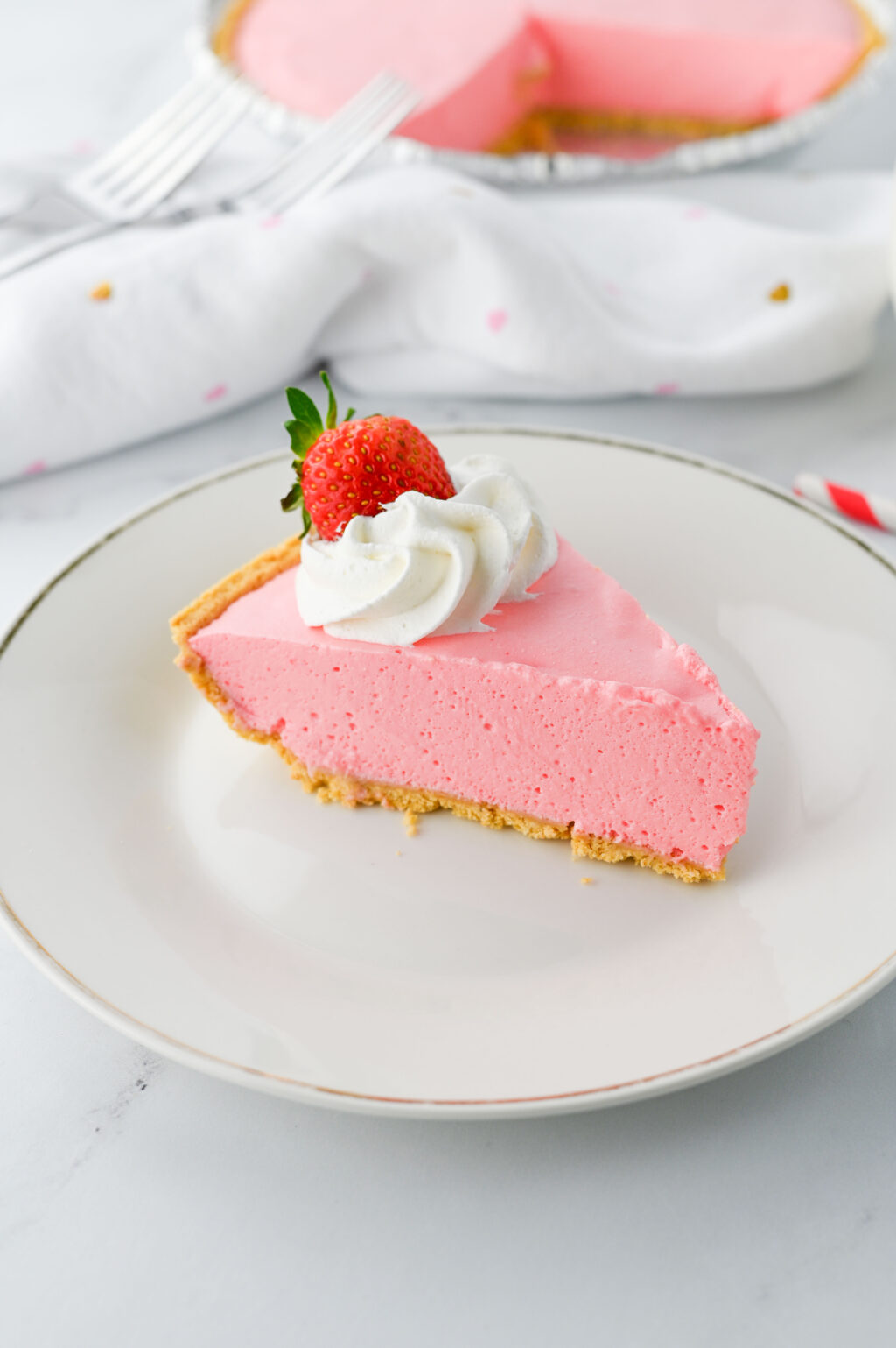 slice of strawberry jello pie on white plate