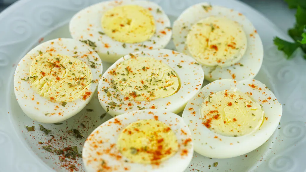 seasoned hard boiled eggs on a plate
